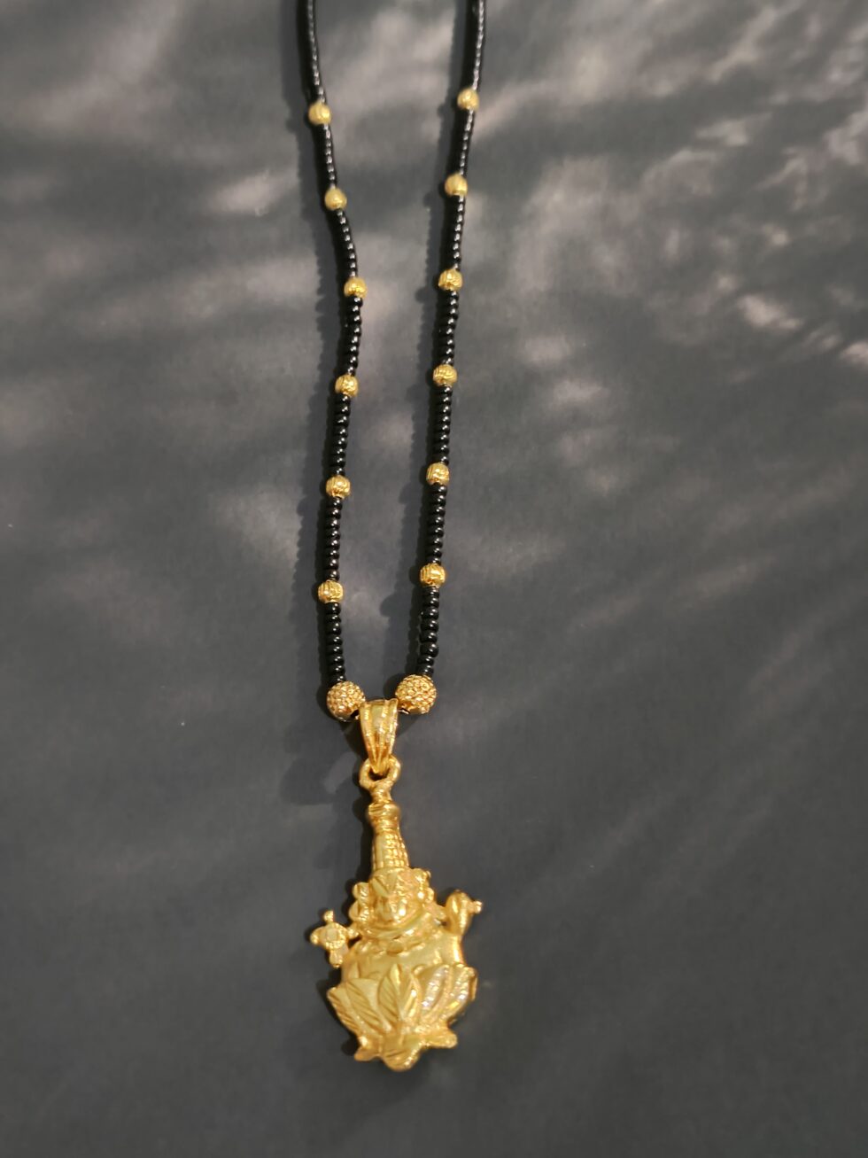 Lord Brahma gold and black beaded necklace
